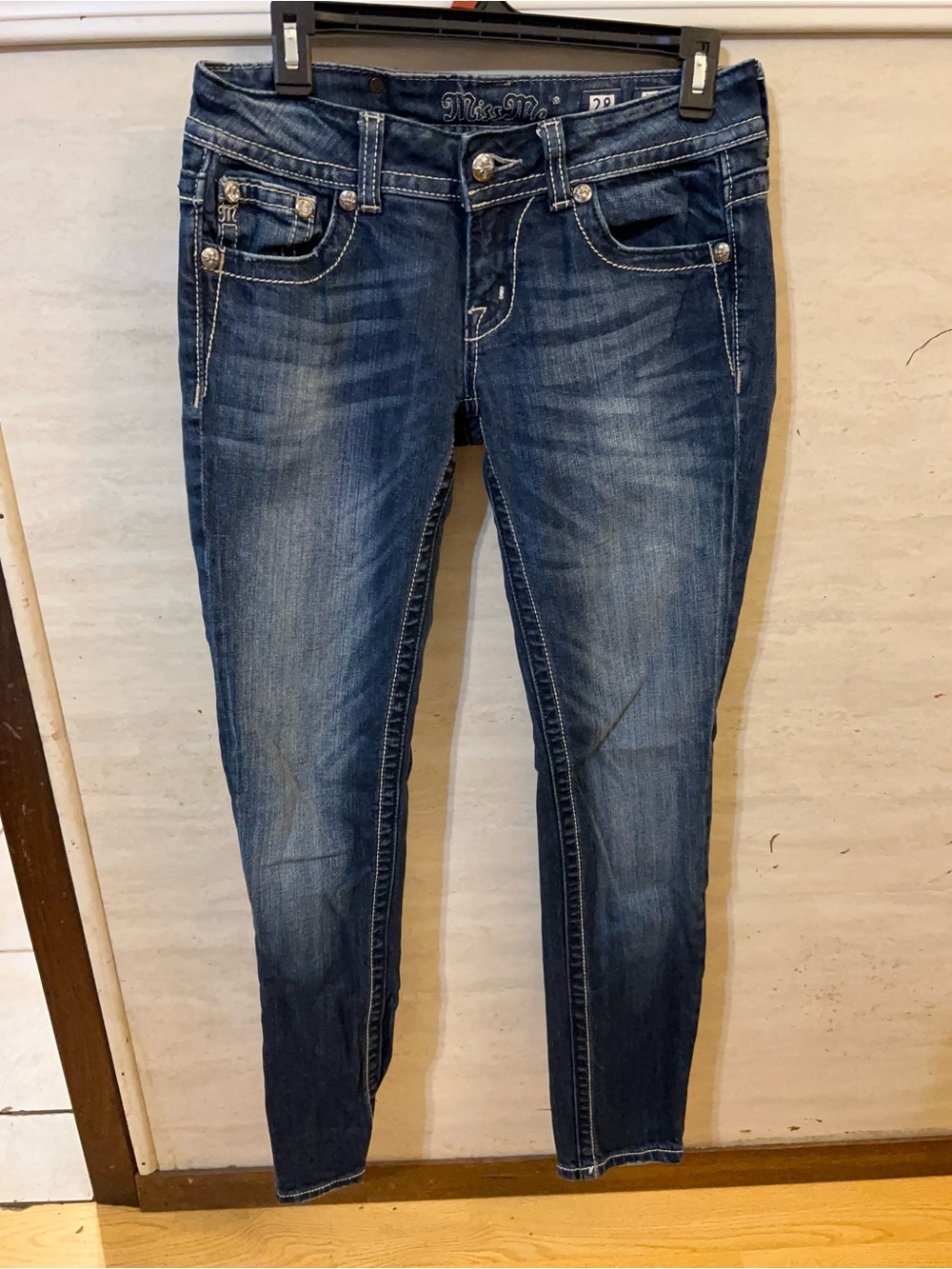 Miss Me skinny jeans, a highly popular denim style